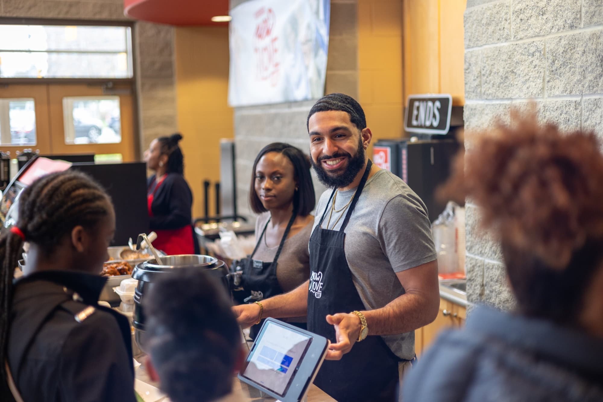 Volunteers serving at the cafe
